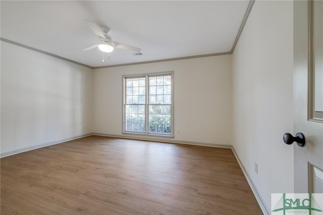 unfurnished room featuring crown molding, light hardwood / wood-style flooring, and ceiling fan