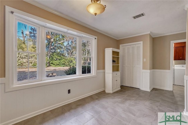 interior space with washer / clothes dryer and crown molding