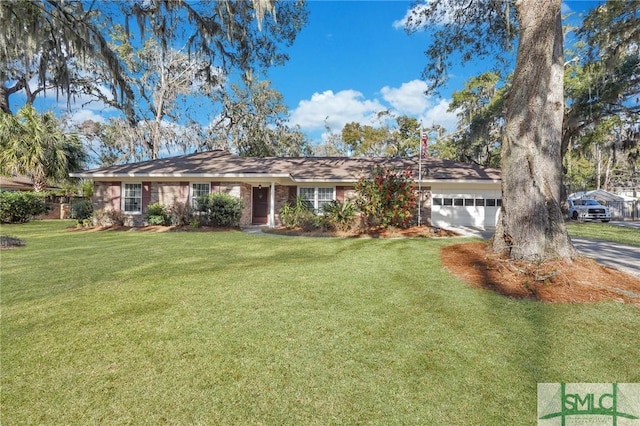 ranch-style house featuring a garage and a front yard