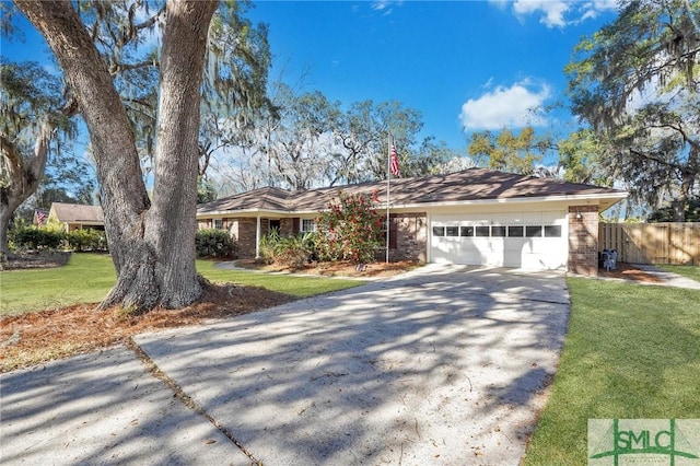 ranch-style house with a garage and a front lawn