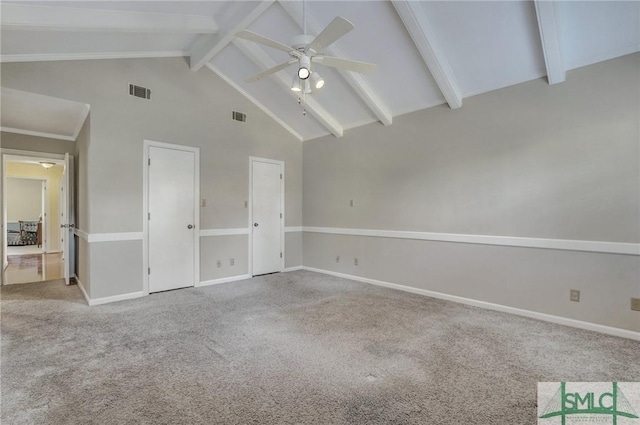 unfurnished bedroom with ceiling fan, beam ceiling, high vaulted ceiling, and light carpet