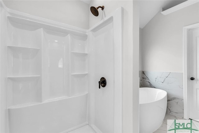 bathroom featuring separate shower and tub and tile walls