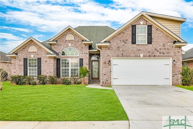 view of property featuring a garage and a front lawn