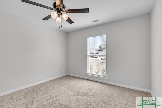 empty room with carpet floors and ceiling fan