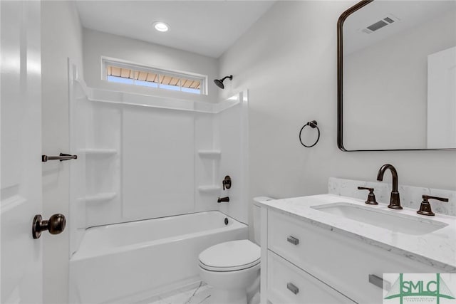 full bathroom featuring vanity, toilet, and washtub / shower combination