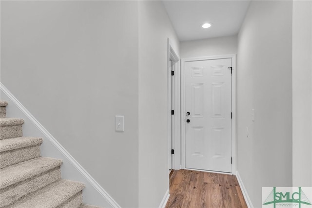 corridor featuring hardwood / wood-style floors