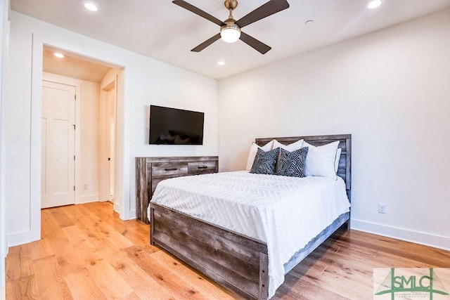 bedroom with ceiling fan and light wood-type flooring