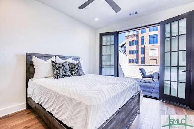 bedroom with hardwood / wood-style flooring and ceiling fan