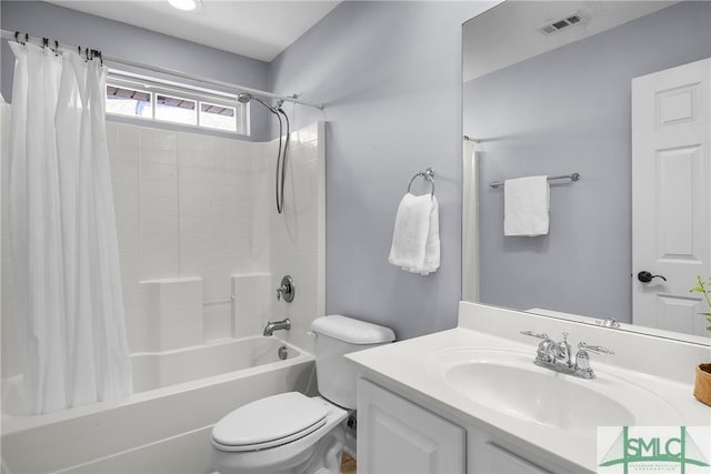 full bathroom featuring vanity, toilet, and shower / bath combo