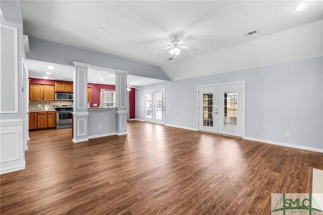 unfurnished living room featuring lofted ceiling, ceiling fan, decorative columns, dark hardwood / wood-style floors, and french doors