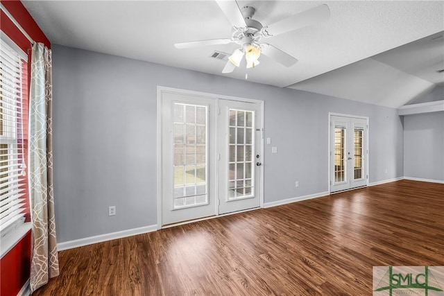 spare room with french doors, ceiling fan, a healthy amount of sunlight, and hardwood / wood-style floors