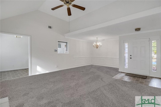 unfurnished living room featuring ornamental molding, high vaulted ceiling, ceiling fan with notable chandelier, and carpet