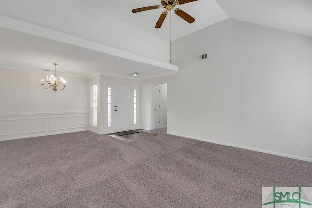 unfurnished living room featuring vaulted ceiling, carpet, ceiling fan with notable chandelier, and crown molding