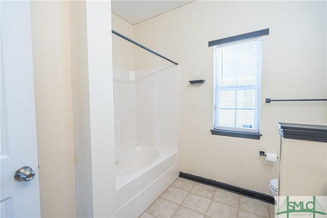 bathroom featuring tile patterned flooring, a textured ceiling, toilet, and washtub / shower combination