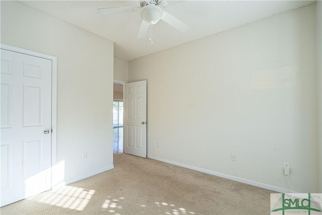 unfurnished bedroom featuring light carpet