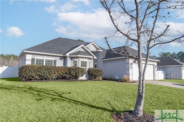 ranch-style house featuring a garage and a front yard