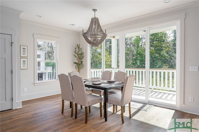 dining area featuring visible vents, dark wood finished floors, and baseboards