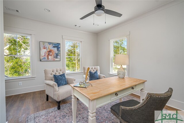 office space with a healthy amount of sunlight, baseboards, visible vents, and wood finished floors