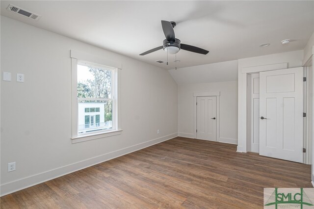 unfurnished bedroom with baseboards, visible vents, and wood finished floors