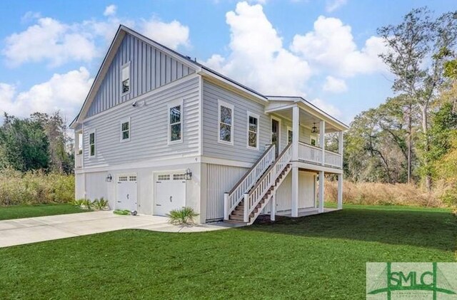 view of front of house featuring concrete driveway, stairway, an attached garage, board and batten siding, and a front yard