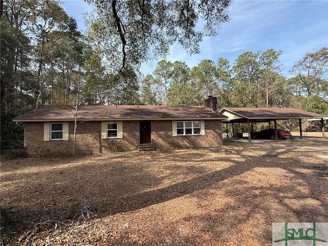 view of front of home featuring a carport