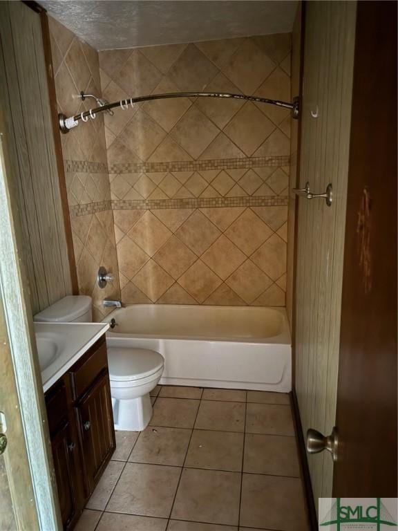 full bathroom with tile patterned flooring, vanity, toilet, and tiled shower / bath