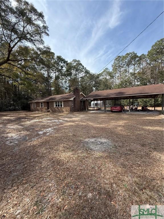 view of front of home featuring a carport