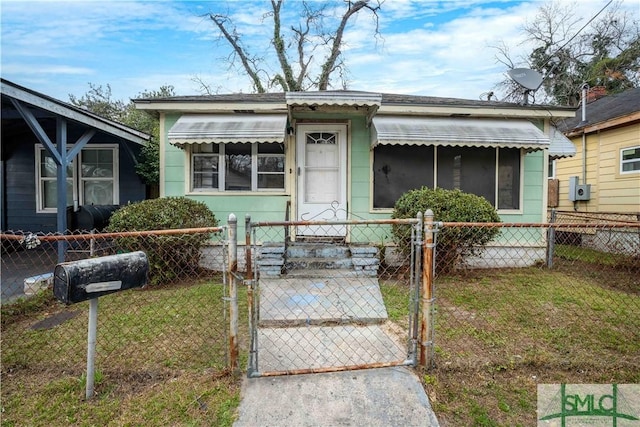 bungalow-style house with a front lawn