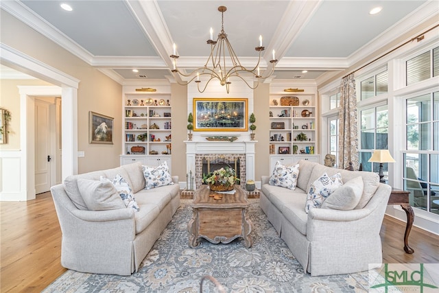 living room featuring beamed ceiling, a fireplace, built in features, and light wood-type flooring