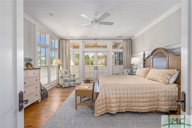 bedroom with french doors, light wood-type flooring, ornamental molding, ceiling fan, and access to exterior