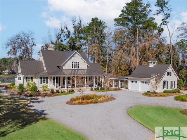 view of front of house with a garage and a porch