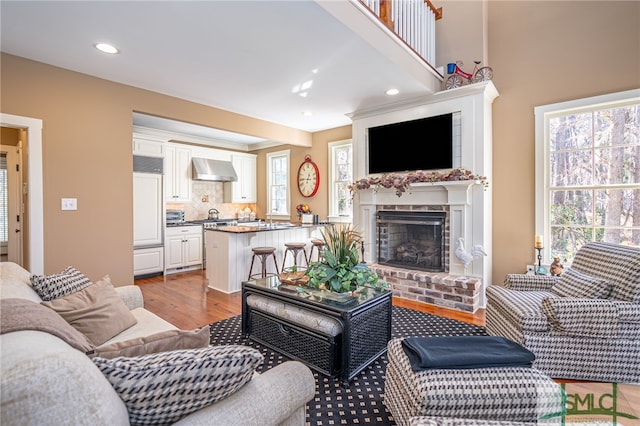 living room featuring a fireplace and light hardwood / wood-style floors