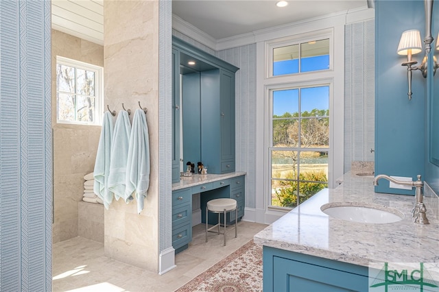 bathroom with vanity, plenty of natural light, and crown molding