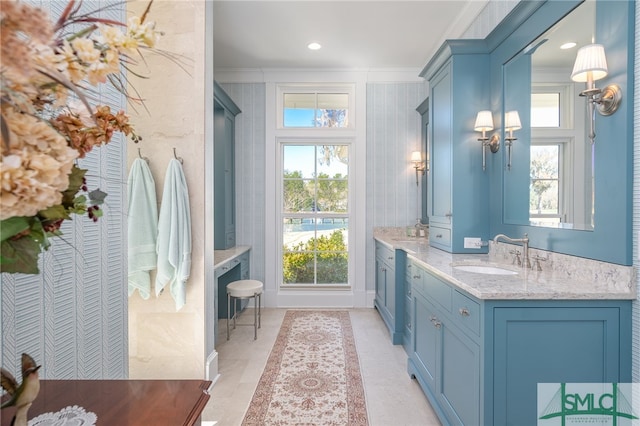 bathroom with ornamental molding and vanity