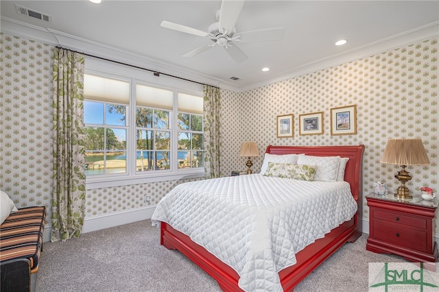 carpeted bedroom with crown molding and ceiling fan