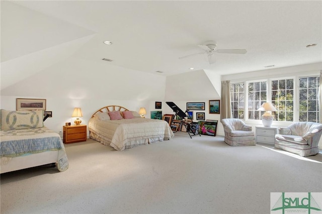 carpeted bedroom with vaulted ceiling and ceiling fan