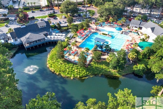 birds eye view of property with a water view