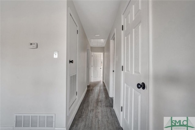 corridor featuring dark hardwood / wood-style floors