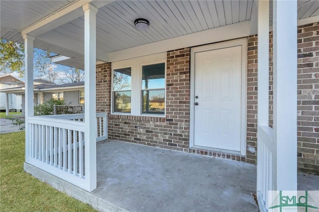 doorway to property featuring a porch