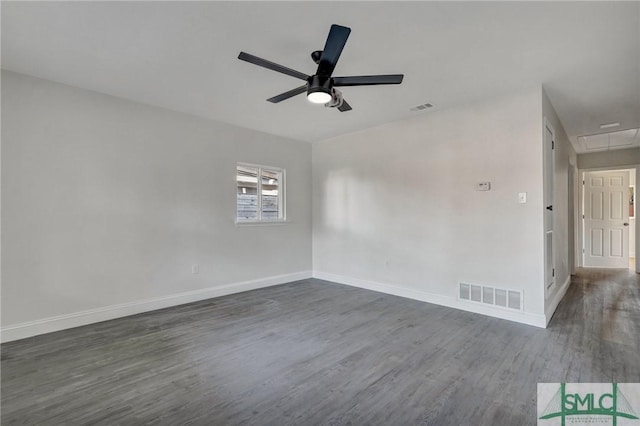 empty room with dark hardwood / wood-style floors and ceiling fan