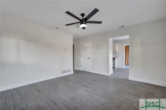 unfurnished room featuring dark hardwood / wood-style floors and ceiling fan