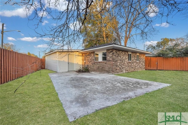 exterior space with a lawn and a patio