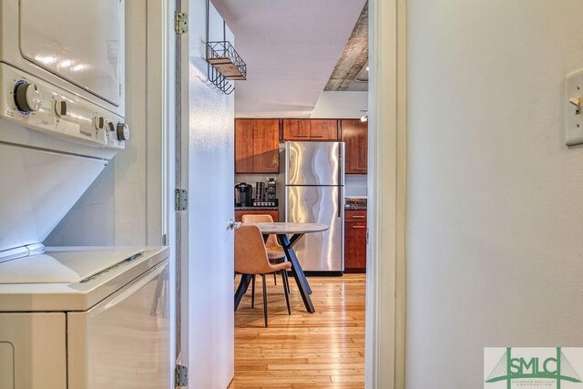 555 Berrien St Unit B, Savannah, GA 31401 - interior space with stacked washer / dryer and light wood-type flooring