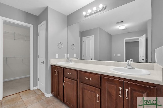 bathroom featuring tile patterned floors and vanity