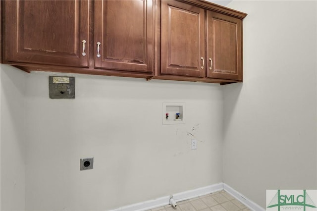 washroom with gas dryer hookup, cabinets, hookup for a washing machine, and electric dryer hookup