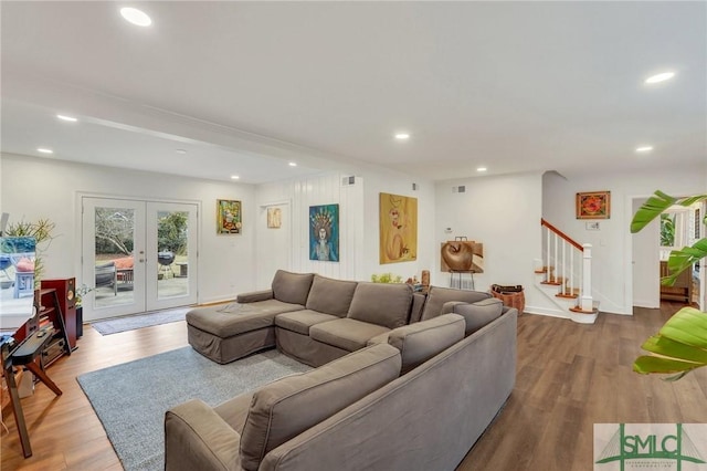 living room featuring hardwood / wood-style flooring and french doors