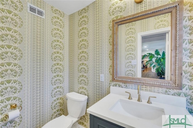 bathroom with vanity and toilet