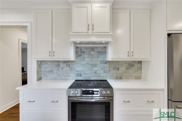 kitchen with white cabinetry, appliances with stainless steel finishes, backsplash, and premium range hood