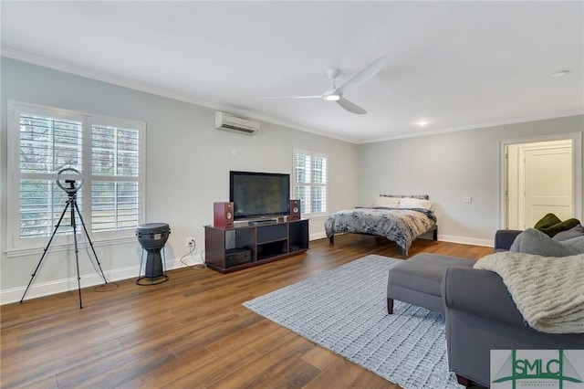 bedroom featuring hardwood / wood-style flooring, crown molding, an AC wall unit, and ceiling fan