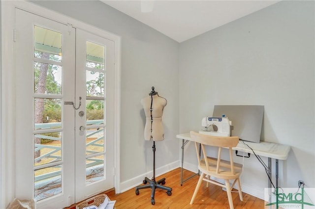 office featuring hardwood / wood-style flooring and french doors